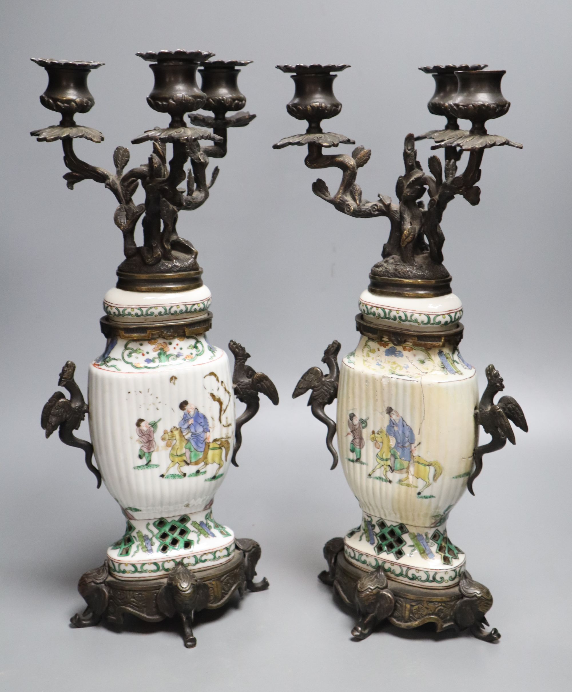 A pair of Chinese famille verte vases converted to candelabra, height 41cm